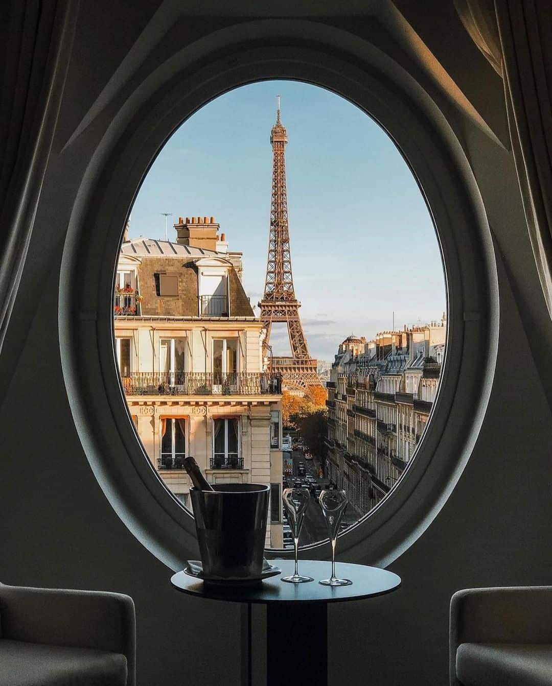 Eiffel Tower through a circle window petite in paris