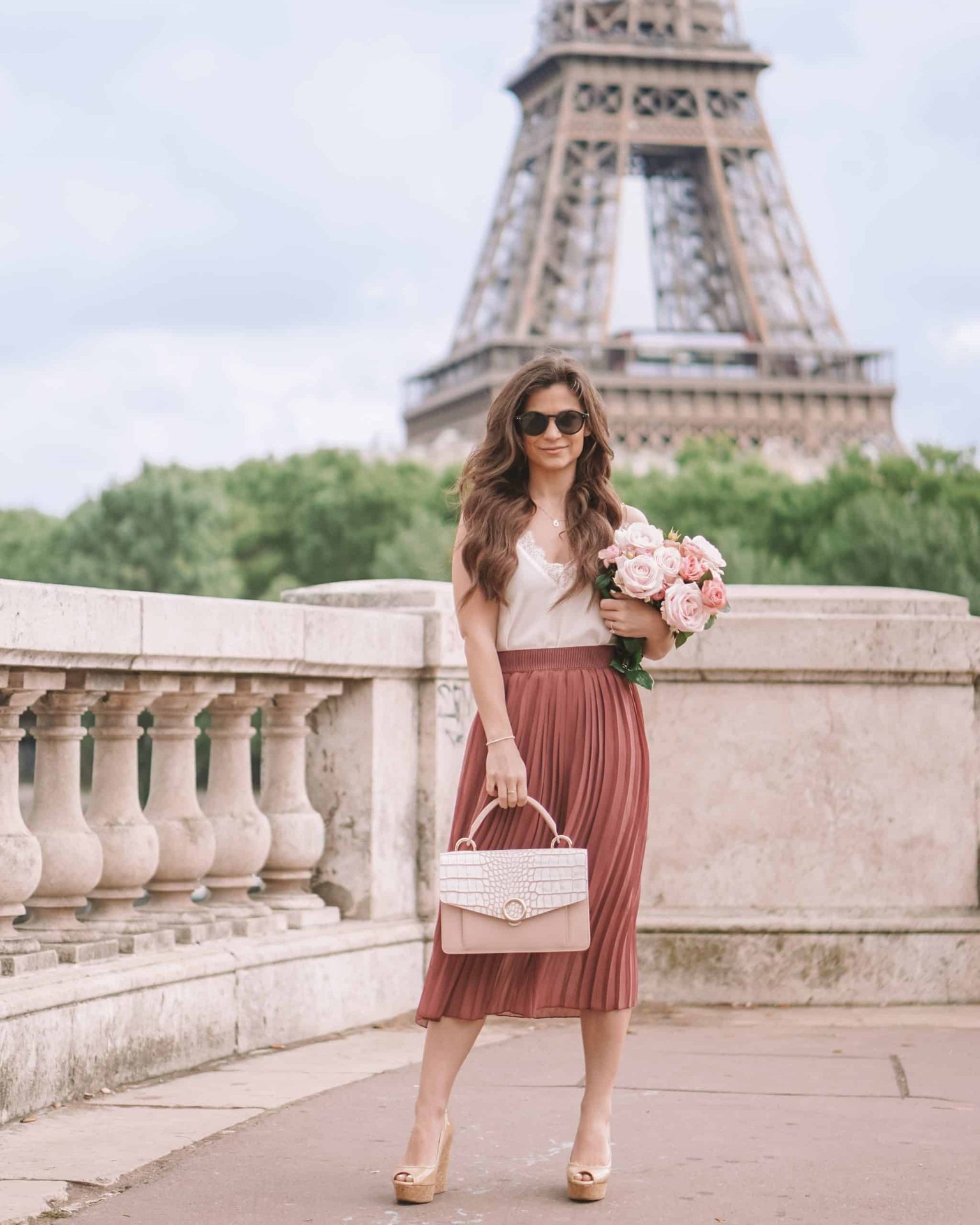 Diane wearing a pleated skirt in Paris