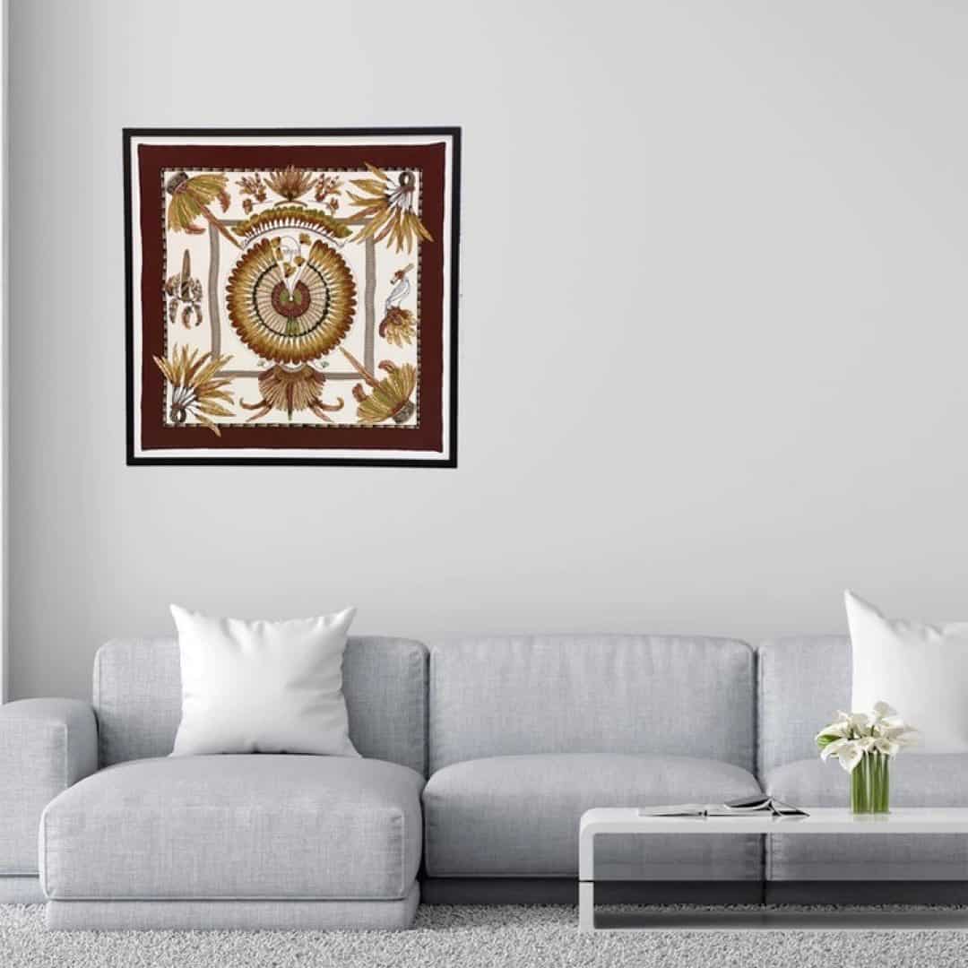 Hermes scarf framed above the couch