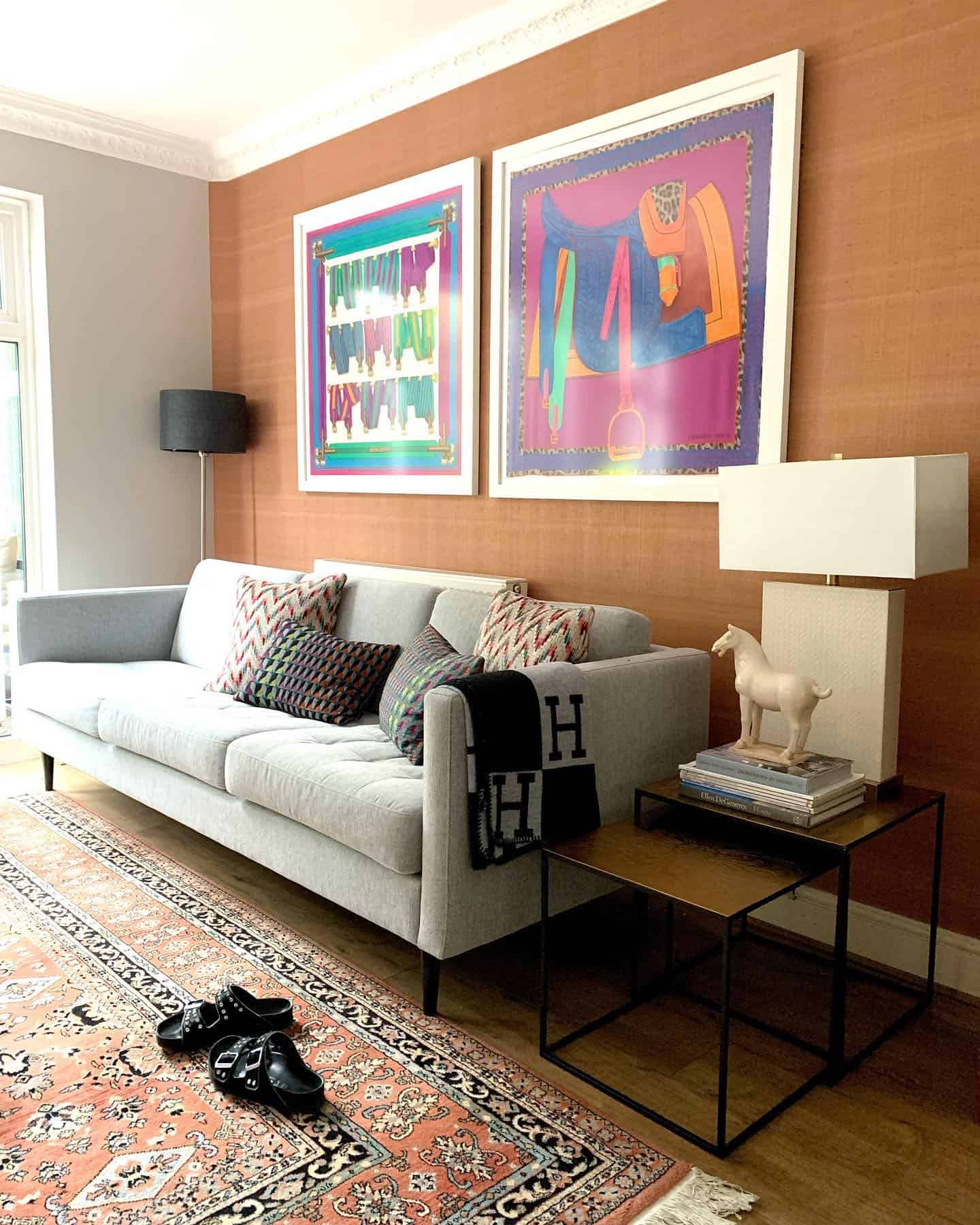 Side by side framed hermes scarves in living room