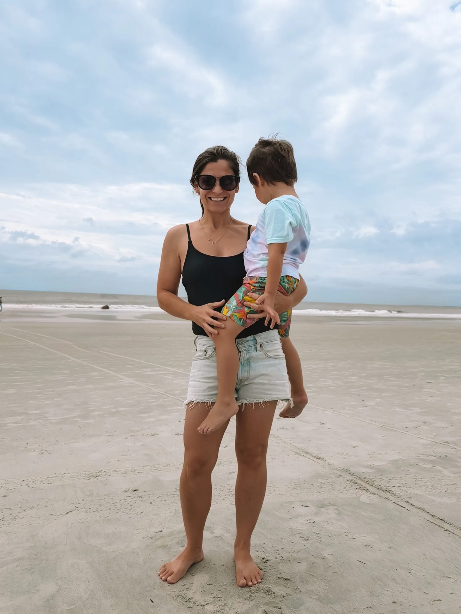Diane holding Felix on the beach at Hilton Head Island